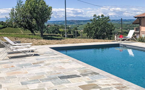 Antica Cascina: Flagstone, Composite Material, Swimming Pool, Tile, Cobblestone, Outdoor Furniture, Shade, Water Feature, Landscaping