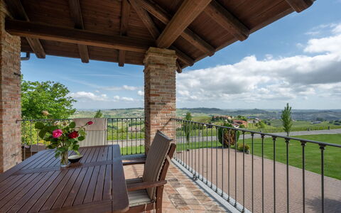 Antica Cascina: Sky, Flower, Property, Cloud, Plant, Furniture, Wood, Shade, Porch, Tree