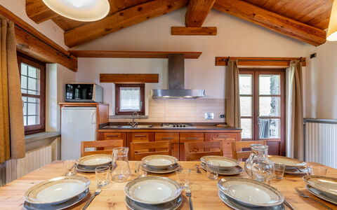 Casot Brusa: Table, Property, Tableware, Dishware, Window, Wood, Interior Design, Lighting, Building, Plate