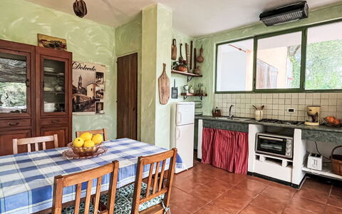 Nisso: Cabinetry, Countertop, Property, Furniture, Wood, Kitchen, Interior Design, Window, Lighting, Table
