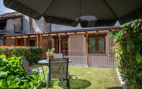 La Maison D'Amelie: Plant, Building, Umbrella, Shade, Table, Grass, Residential Area, Outdoor Furniture, Wood, Real Estate