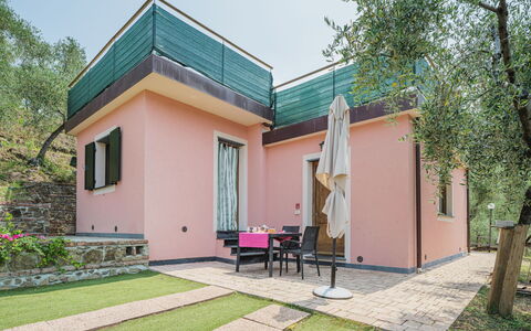 Villetta Linara: Plant, Property, Sky, Building, Tree, Land Lot, Cottage, Shade, Residential Area, Siding
