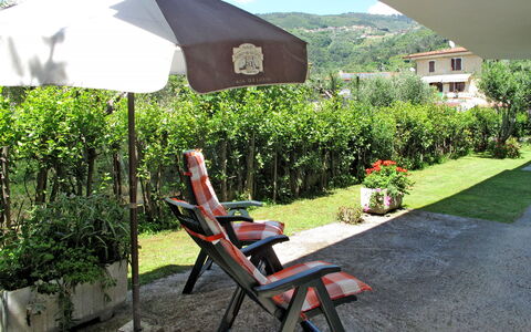 Mandarino: Plant, Plant Community, Sky, Nature, Building, Shade, Chair, Outdoor Furniture, Grass, Outdoor Table