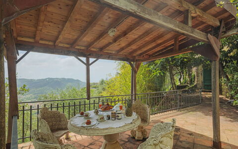 La Grotta: Table, Property, Furniture, Plant, Chair, Shade, Outdoor Table, Interior Design, Outdoor Furniture, Porch
