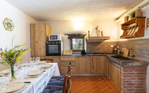 La Casina: Countertop, Property, Cabinetry, Furniture, Kitchen, Interior Design, Wood, Table, Flooring, Floor