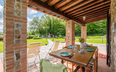 Dilia: Property, Plant, Table, Furniture, Chair, Wood, Shade, Interior Design, Tree, Outdoor Furniture