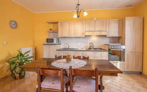 Casa Martina: Furniture, Countertop, Plant, Cabinetry, Table, Sink, Wood, Kitchen, Lighting, Houseplant