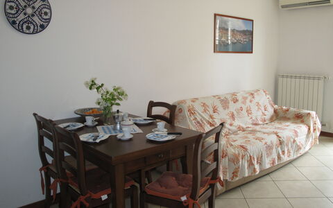 Cala Azzurra (Imp312): Room, Property, Furniture, Table, Interior Design, Wall, Living Room, Floor, Coffee Table, Real Estate