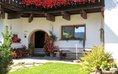 Ortisei St Ulrich 609: Flower, Plant, Building, Window, House, Flowerpot, Door, Vegetation, Yellow, Chair