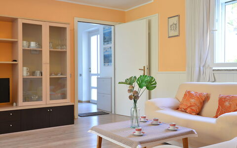 Lago di Caldonazzo 700: Room, Living Room, Property, Furniture, Interior Design, Orange, Building, Yellow, Floor, House