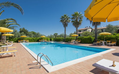 Cecina 613: Water, Sky, Plant, Property, Furniture, Swimming Pool, Building, Azure, Tree, Umbrella