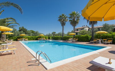 Cecina 613: Water, Sky, Plant, Property, Furniture, Swimming Pool, Building, Azure, Tree, Umbrella