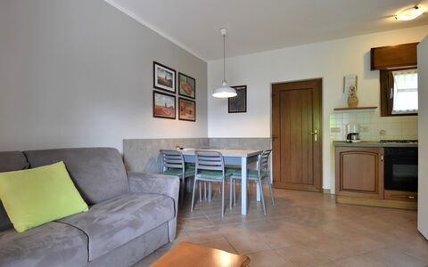 Lago D'Idro 649: Furniture, Table, Property, Couch, Cabinetry, Picture Frame, Wood, Countertop, Lighting, Interior Design