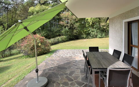 Lago D'Idro 650: Table, Plant, Furniture, Property, Building, Tree, Shade, Chair, Wood, Flooring