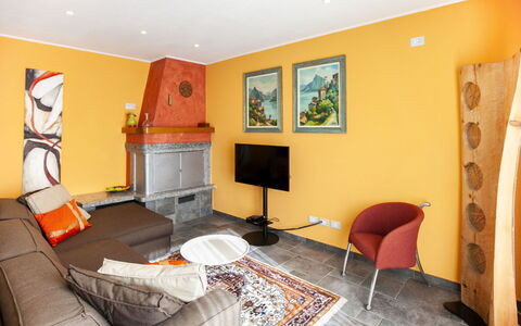 Bellavista: Furniture, Property, Television, Comfort, Picture Frame, Orange, Interior Design, Home Appliance, Flooring, Floor