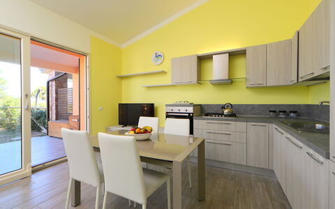 Baia delle Mimose: Property, Room, Furniture, Yellow, Interior Design, Building, House, Kitchen, Real Estate, Cabinetry