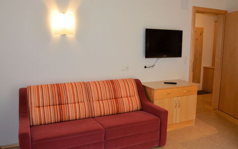 Georg: Furniture, Couch, Comfort, Cabinetry, Wood, Flooring, Living Room, Floor, Building, Lamp