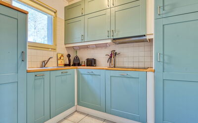 Hameaux du Golf 140.7: Cabinetry, Kitchen, Wood, Flooring, Kitchen Appliance, Interior Design, Major Appliance, Countertop, Floor, Cupboard