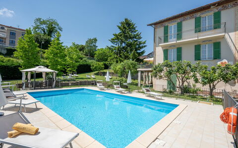Savio: Water, Plant, Sky, Property, Swimming Pool, Building, Azure, Window, Shade, Outdoor Furniture