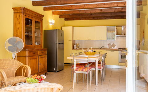 Savio: Table, Furniture, Cabinetry, Property, Countertop, Wood, Kitchen, Interior Design, Flooring, Yellow