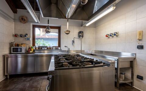 La Grotta di Cech: Cabinetry, Countertop, Kitchen, Kitchen Stove, Interior Design, Kitchen Appliance, Sink, House, Wood, Gas Stove