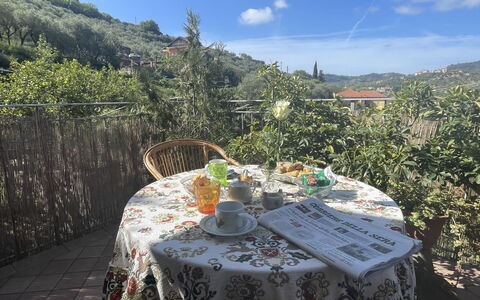 Casa dei Nonni (Imp425): Sky, Cloud, Property, Plant, Table, Mountain, Natural Landscape, Tablecloth, Chair, Tree
