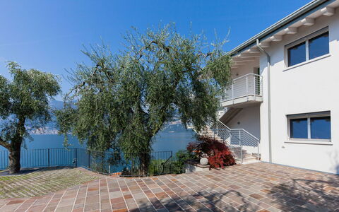 Brenzone 699: Sky, Property, Window, Building, Road Surface, Plant, Wood, Shade, House, Flooring
