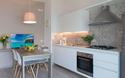 Brenzone 699: Countertop, Furniture, Room, Kitchen, Property, Cabinetry, Kitchen Stove, Interior Design, Floor, Turquoise