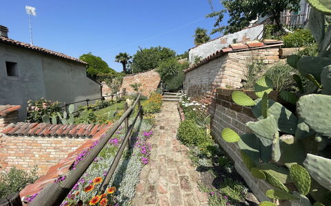 Il Ghiro: Plant, Flower, Sky, Tree, Building, Groundcover, Landscape, Shrub, Grass, Walkway