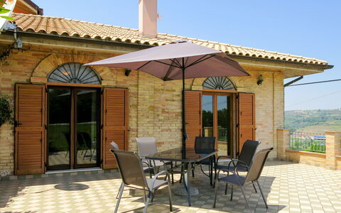 Gabriele: Sky, Property, Furniture, Chair, Window, Shade, Outdoor Furniture, Building, Cottage, Outdoor Table
