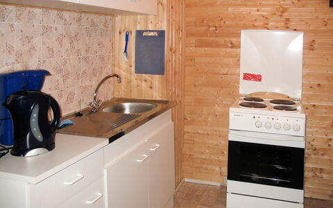Schöser: Room, Countertop, Property, Kitchen, Major Appliance, Tile, Cabinetry, Furniture, Floor, Kitchen Stove