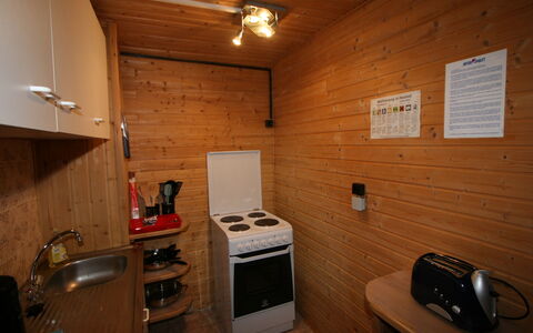 Schöser: Property, Kitchen Appliance, Wood, Cabinetry, Home Appliance, Floor, Flooring, Countertop, Kitchen Stove, Stove
