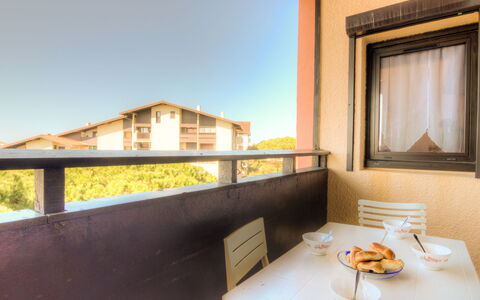 Douc: Table, Building, Window, Tableware, Sky, Wood, Shade, Plant, Dishware