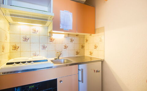 Douc: Room, Property, Kitchen, Cabinetry, Furniture, Interior Design, Tile, Yellow, Orange, Building