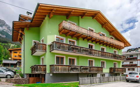 Pozza di Fassa 653: Building, Wheel, Property, Sky, Cloud, Window, Vehicle, Car, Urban Design