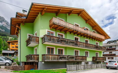 Pozza di Fassa 653: Building, Wheel, Property, Sky, Cloud, Window, Vehicle, Car, Urban Design