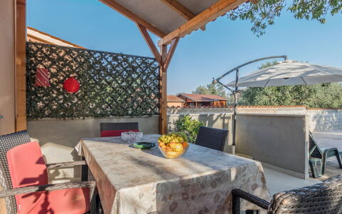 Ruza: Table, Furniture, Sky, Property, Plant, Flowerpot, Chair, Shade, Interior Design, Building