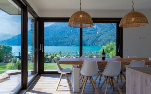 Brezza di Lago: Plant, Furniture, Sky, Property, Table, Water, Azure, Shade, Chair, Architecture