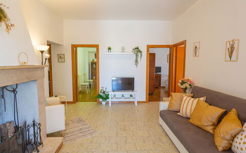 Erika: Property, Picture Frame, Building, Couch, Architecture, Interior Design, Floor, Living Room, Chair, Wood