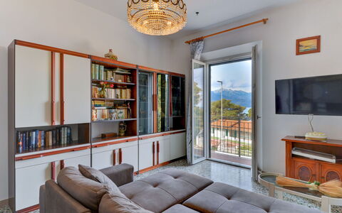 Al Tramonto: Furniture, Property, Couch, Table, Bookcase, Picture Frame, Shelf, Living Room, Wood, Lighting