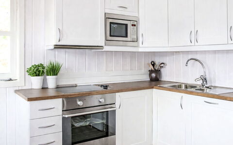 Risdalbu: Cabinetry, Kitchen, Countertop, Kitchen Appliance, Flooring, Furniture, Wood, Interior Design, Major Appliance, Drawer