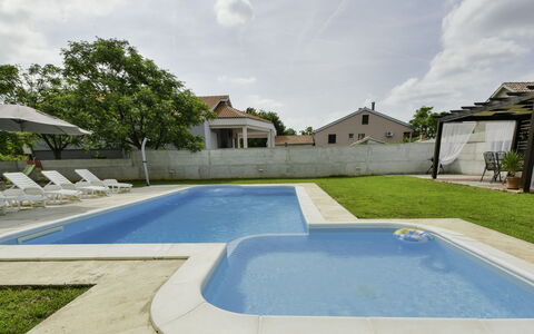 Stipe: Cloud, Sky, Property, Building, Azure, Plant, Land Lot, Swimming Pool, Grass, Shade