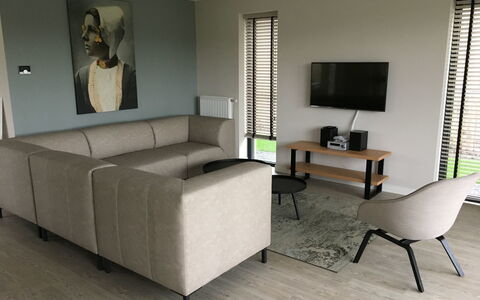 Oesterdam Resort: Furniture, Living Room, Room, Interior Design, Property, Floor, Couch, Table, Chair, Sofa Bed