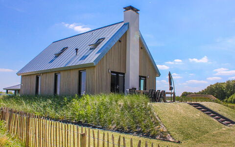 Oesterdam Resort: Sky, Plant, Cloud, Window, Building, Natural Landscape, House, Land Lot, Fence, Grass