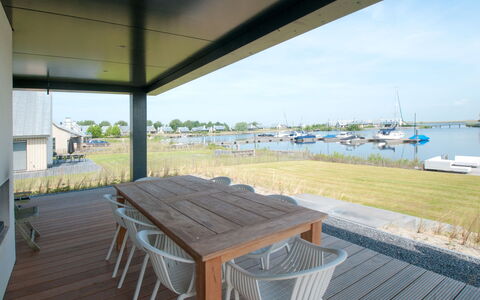 Oesterdam Resort: Water, Property, Sky, Table, Shade, Outdoor Furniture, Wood, Chair, Boat, Outdoor Table