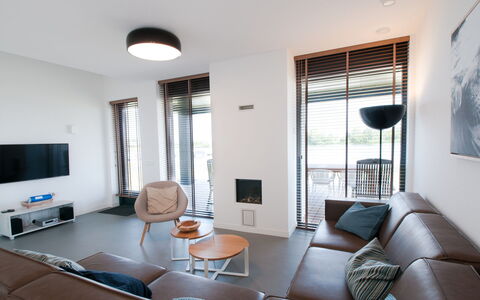 Oesterdam Resort: Couch, Furniture, Property, Table, Azure, Comfort, Window, Chair, Shade, Door