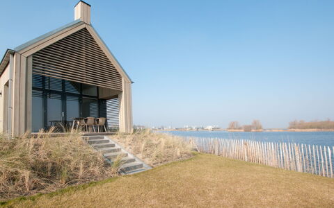 Oesterdam Resort: Property, Sky, House, Sea, Real Estate, Shore, Coast, Building, Architecture, Home