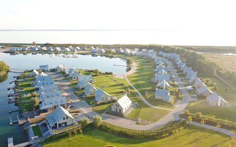 Oesterdam Resort: Water, Property, Sky, Natural Landscape, Urban Design, Land Lot, Architecture, Grass, Lake, Biome