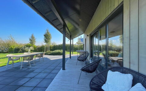 Oesterdam Resort: Furniture, Table, Building, Chair, Tableware, Cloud, Sky, Tablecloth, Outdoor Furniture, Shade