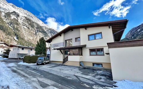Max: Cloud, Sky, Building, Wheel, Window, Mountain, Azure, Snow, House